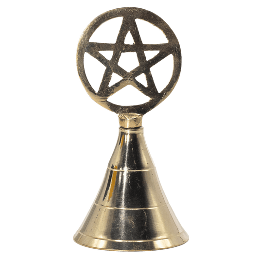 Brass bell with pentagram design on a green background
