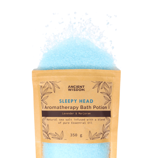 The blue Aromatherapy Bath potion natural sea salt bursting out of the kraft packet