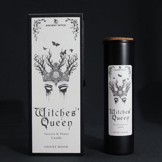 Witches' Queen candle and packaging with black and white design on a dark background