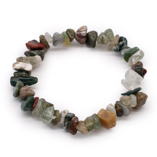 Multicolored stone bracelet of greens and earthy browns on a white background