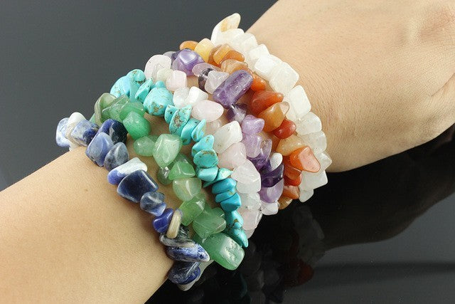 Multiple chipstone bracelets on a persons wrist