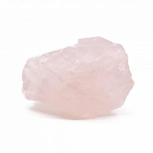A rough, raw piece of rose quartz gemstone on a white background.