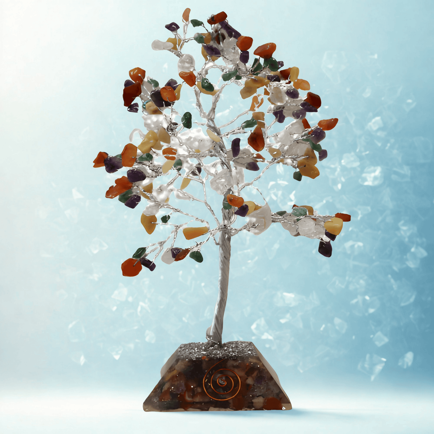 Crystal tree with multicolored stones on a light blue background