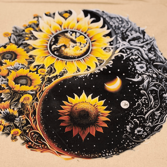 Enlarged view of the sunflower design and celestial yin yang elements on the cotton drawstring bag