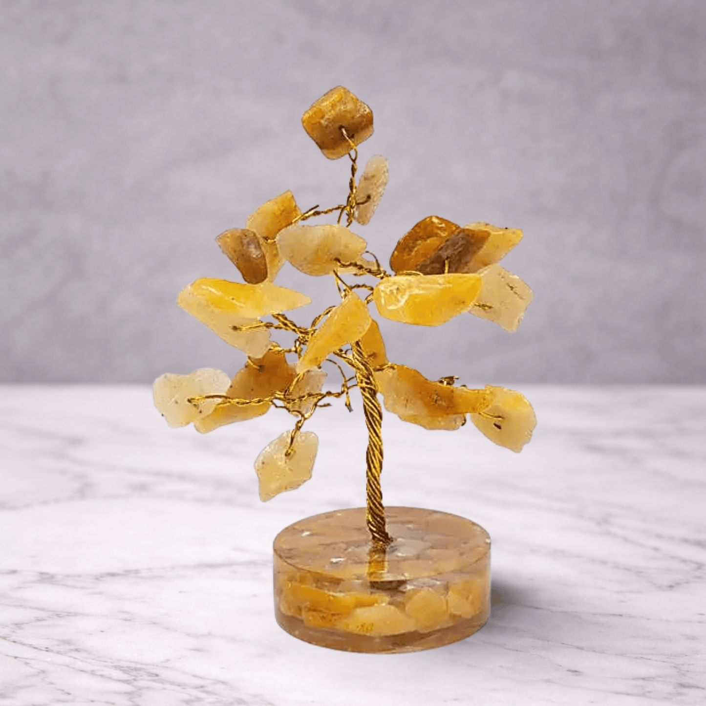 Yellow stone tree on a clear base with a gray background