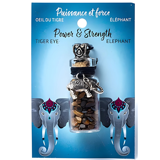 Jewelry packaging with tiger eye and elephant charm on a blue background