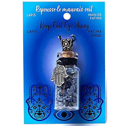 Pendant with stones in a glass bottle on a blue card with text