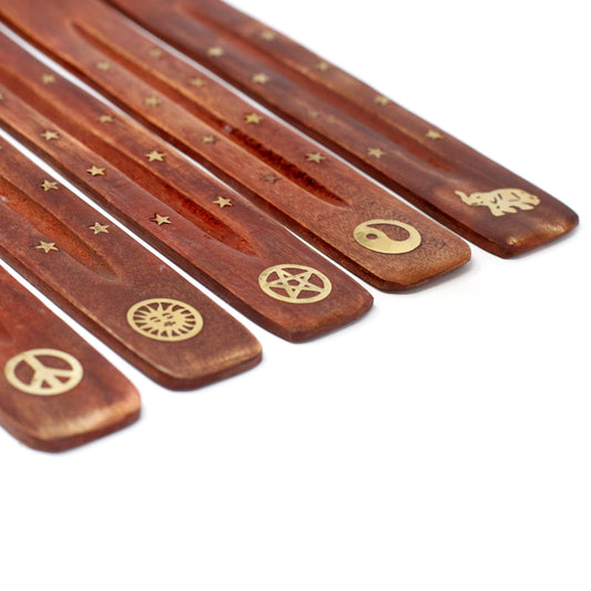 Set of wooden sticks with engraved symbols on a white background