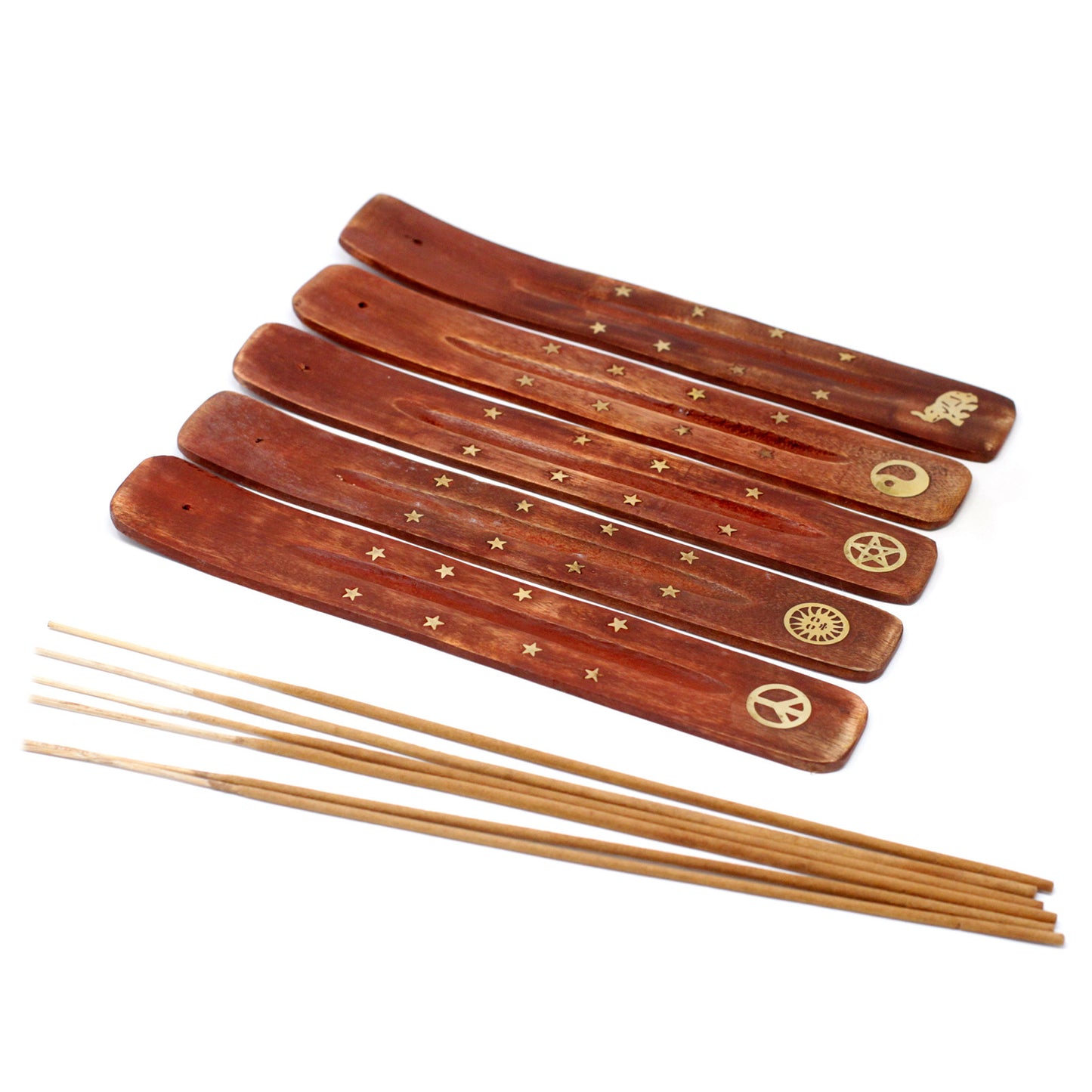 Set of wooden incense sticks with decorative ends on a white background