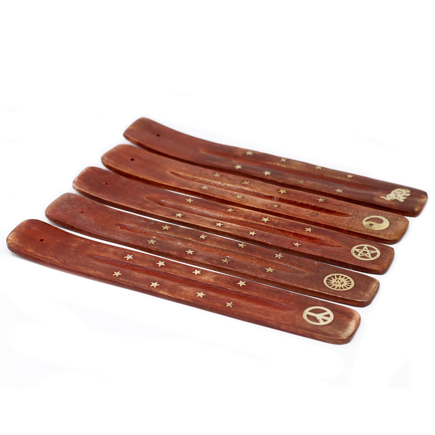 Set of wooden incense sticks with engraved symbols on a white background