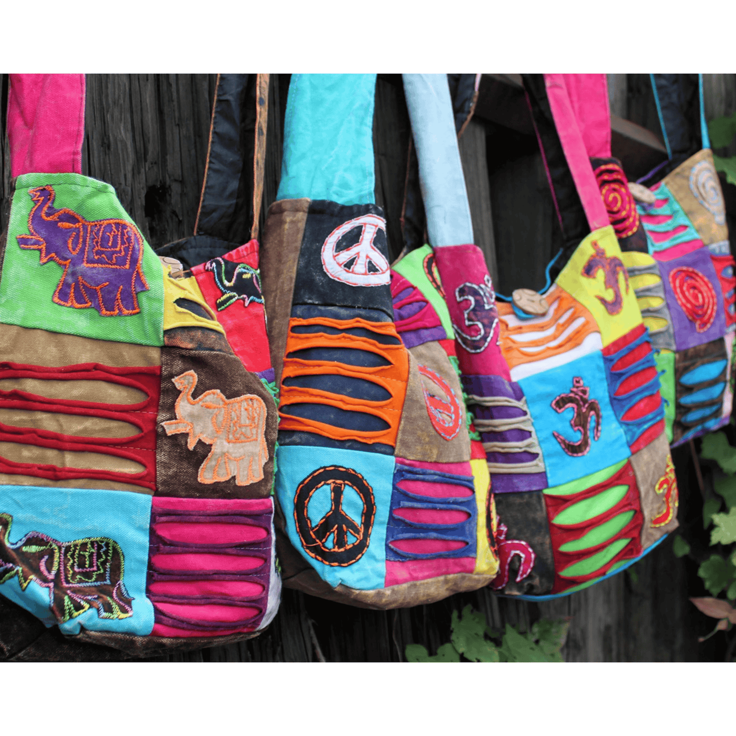 Colorful patchwork bags with various patterns and symbols.