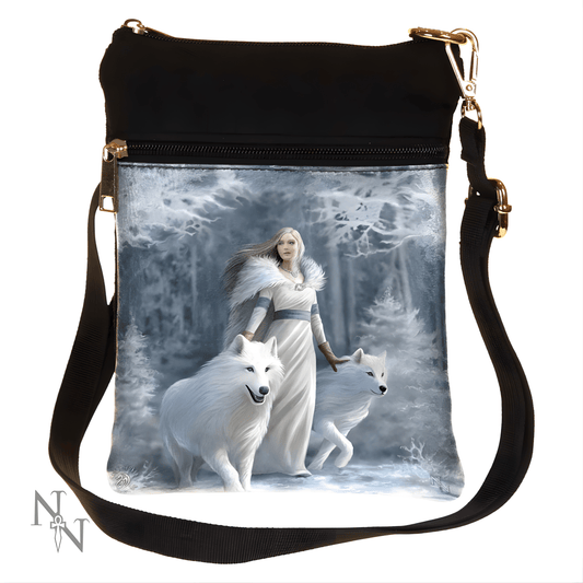 Shoulder bag with a design of a woman in a white dress walking with two white wolves in a snowy forest.