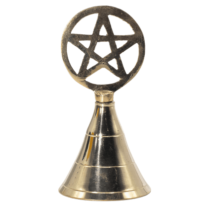 Brass bell with pentagram design on a green background