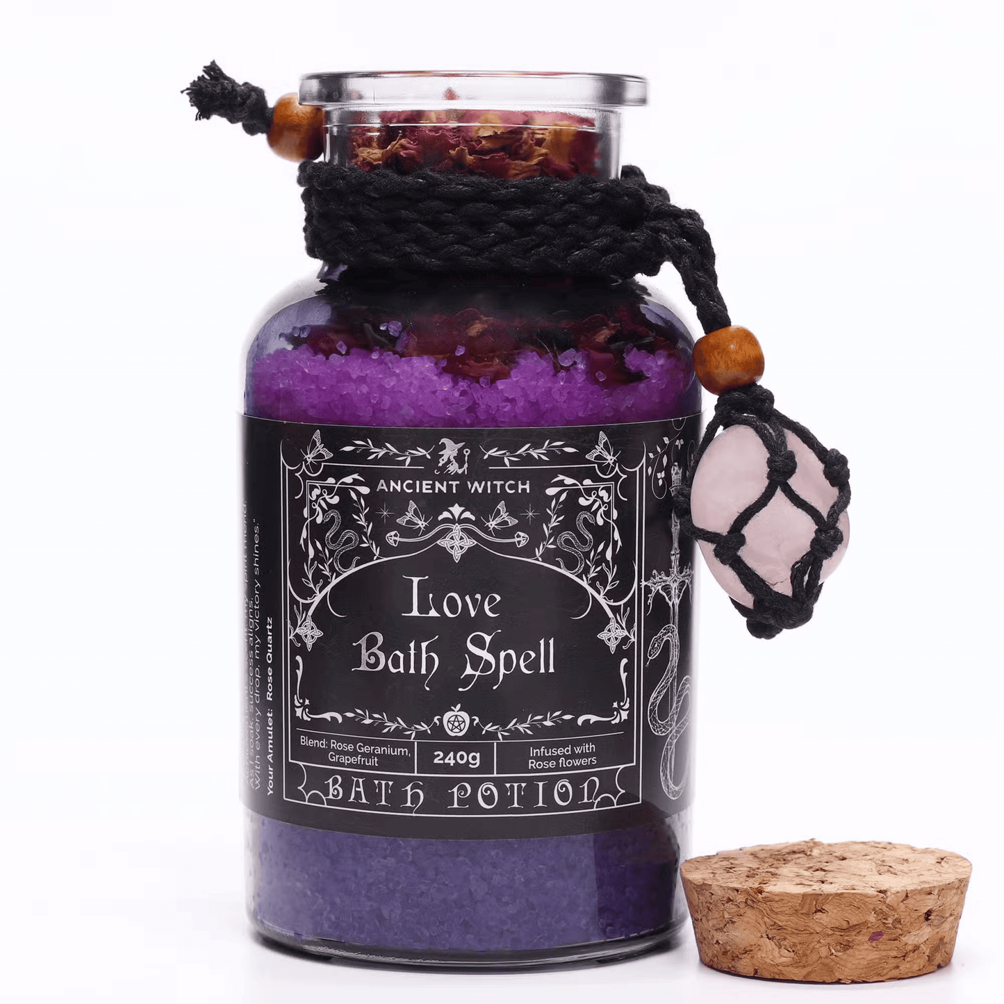 Bottle labeled 'Love Bath Spell' with purple contents and decorative elements on a white background