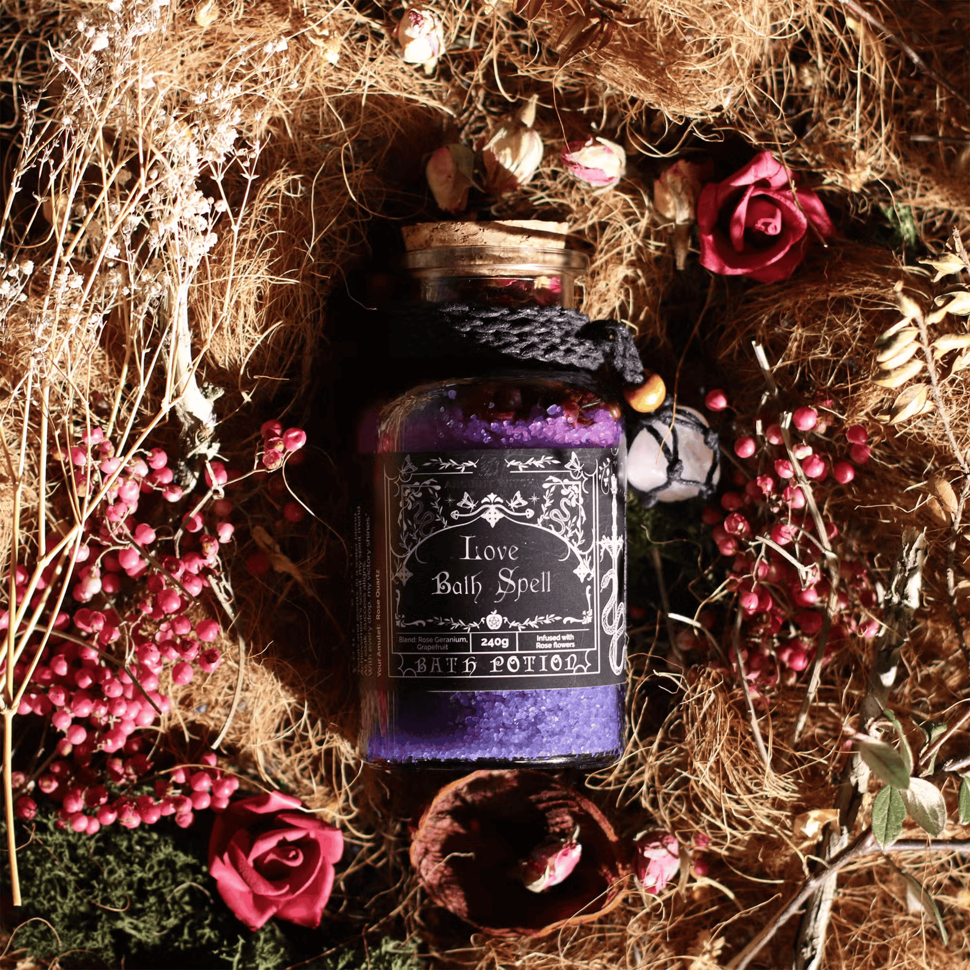 Bottle labeled 'Love Bath Spell' surrounded by flowers and herbs on a rustic background