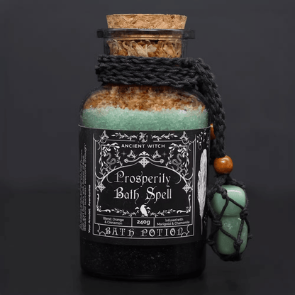Bottle of 'Prosperity Bath Spell' bath potion with decorative label on a dark background