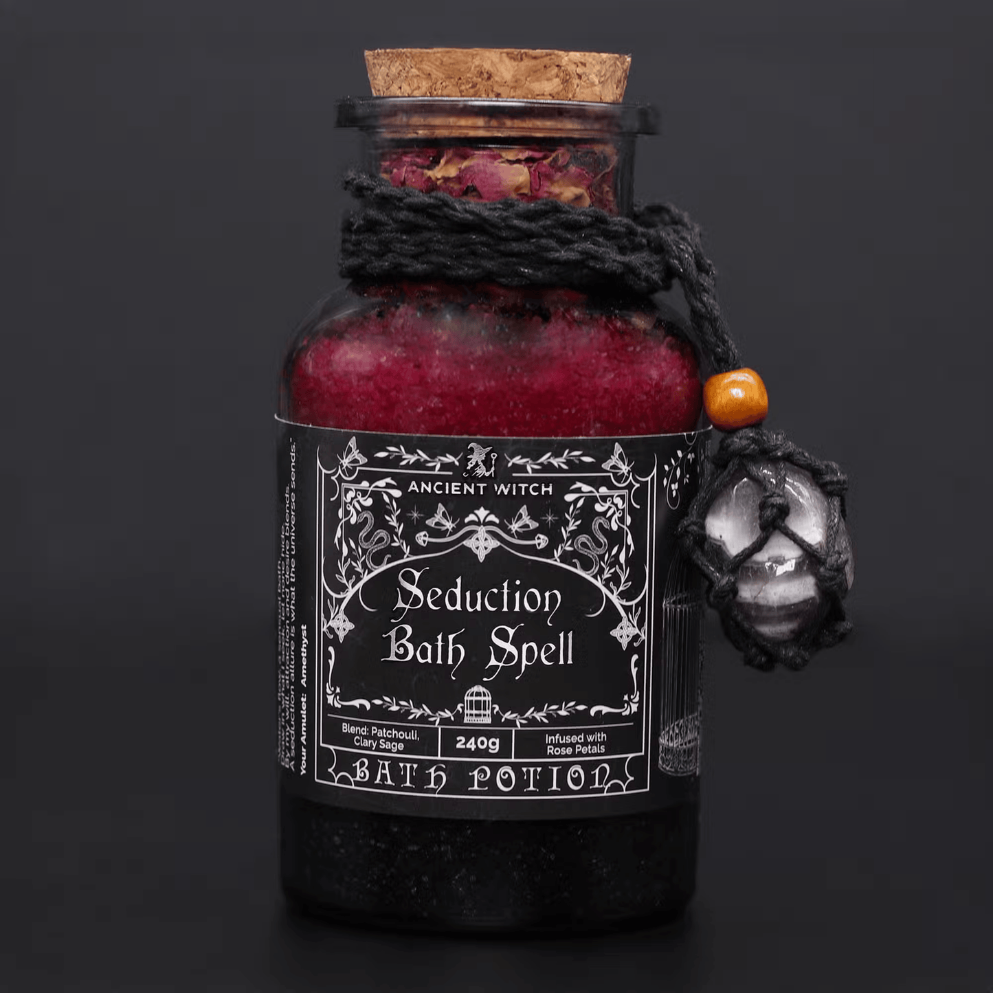 Bath potion bottle labeled 'Seduction Bath Spell' with decorative elements on a dark background