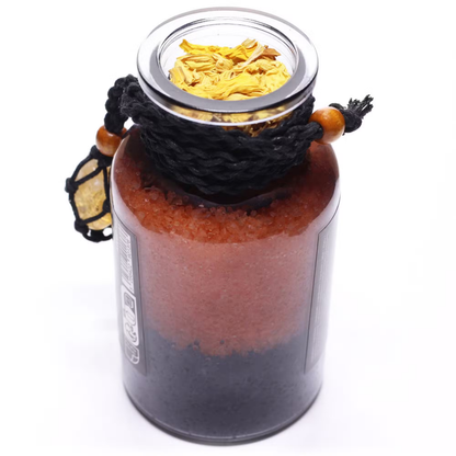 Glass jar with layered contents on a white background
