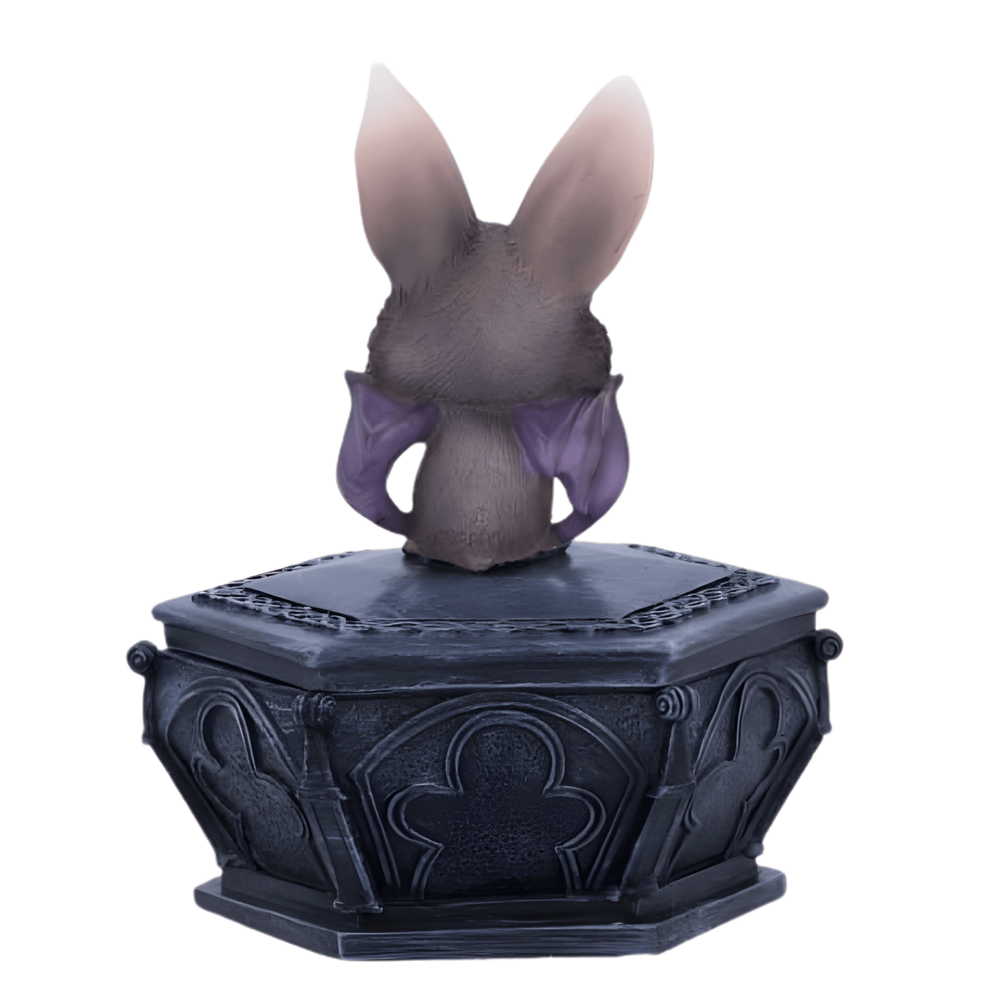 Back of a bat creature on a decorative black base with intricate designs