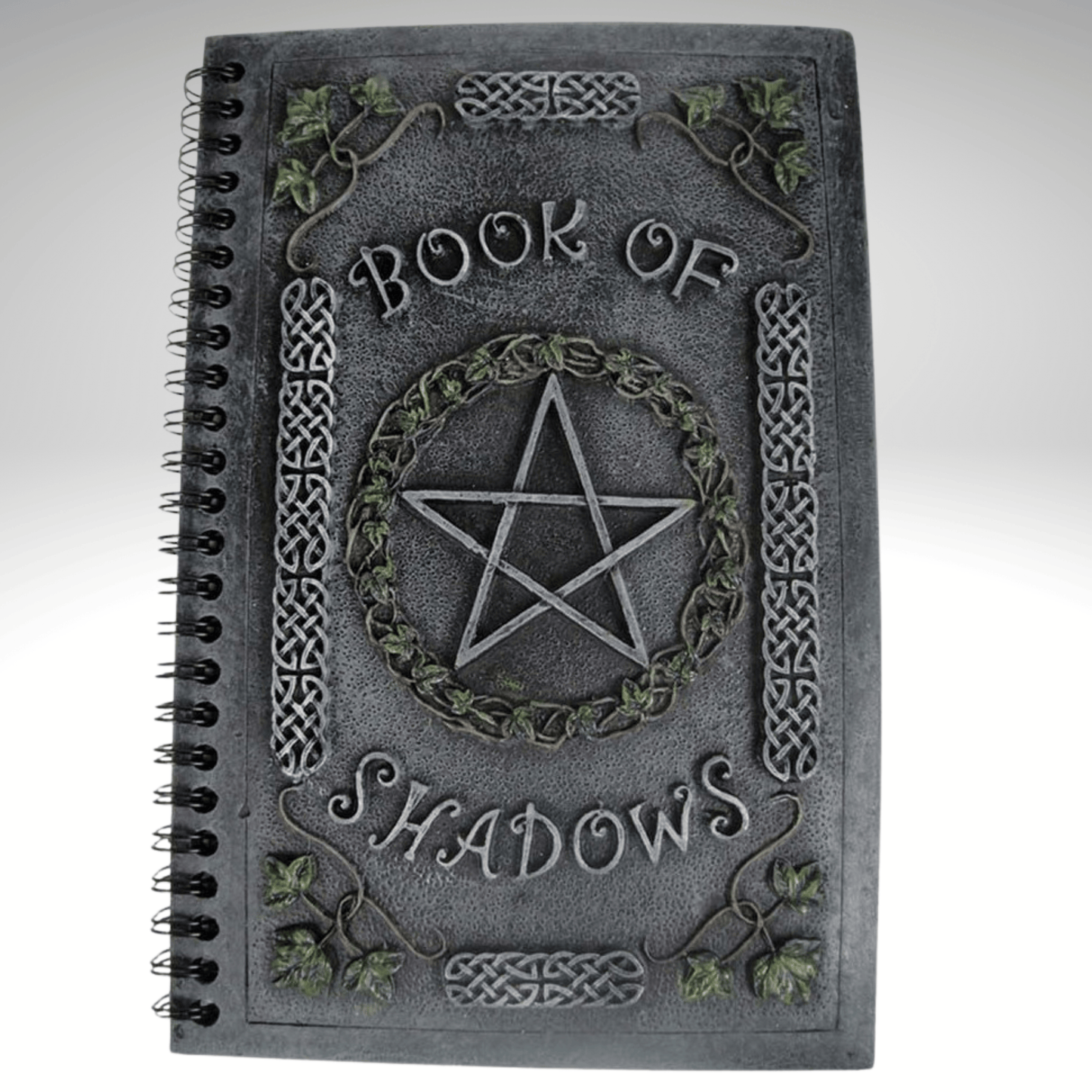 Book of Shadows with pentagram design on a resin cover, on a gray background