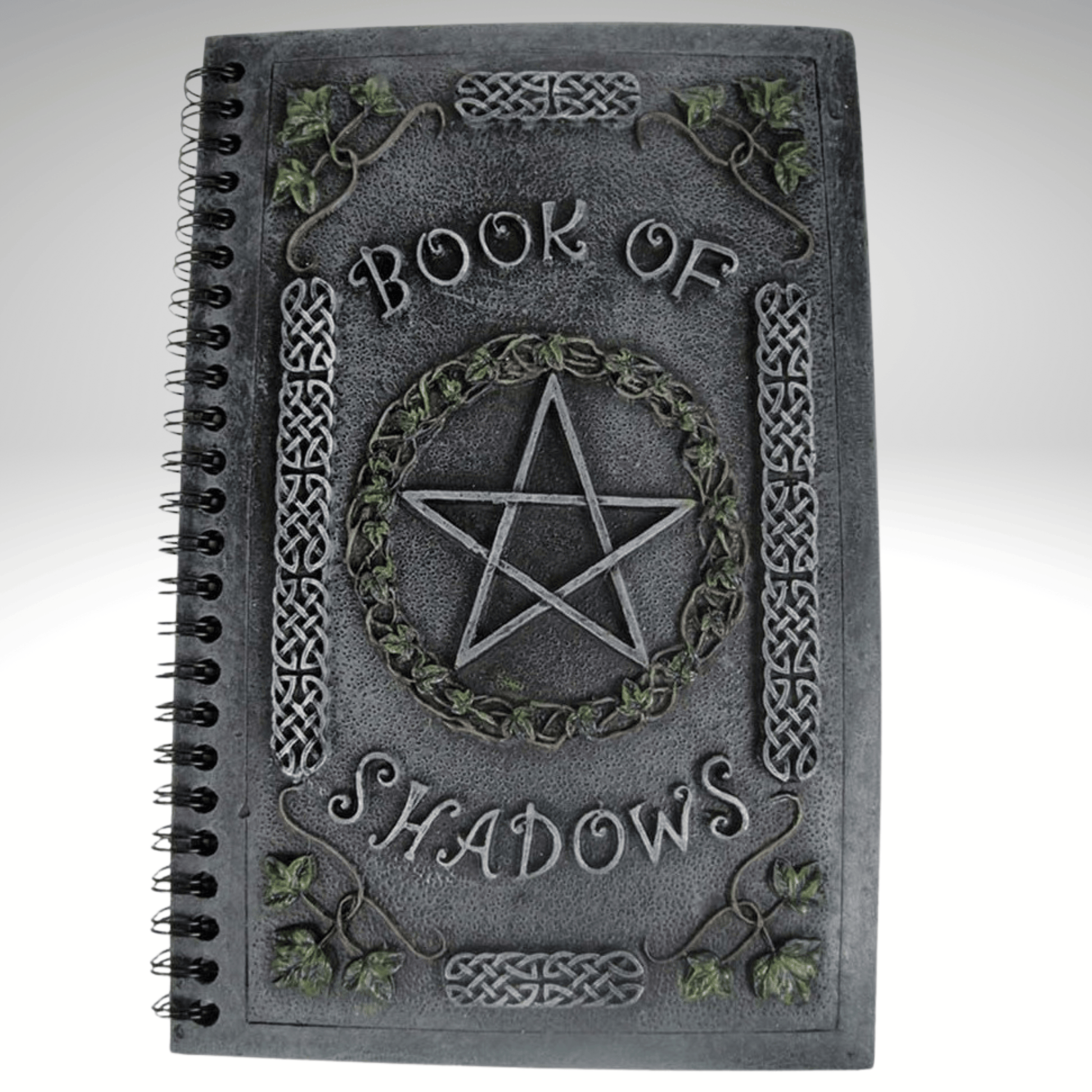 Book of Shadows with pentagram design on a resin cover, on a gray background