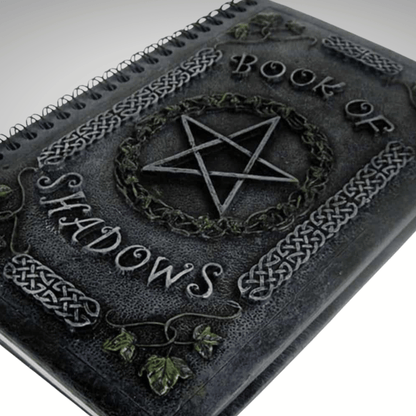 Dark resin cover book titled 'Book of Shadows' with pentagram design on a white background