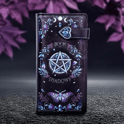 Phone case with pentagram design and 'Book of Shadows' text on a dark background