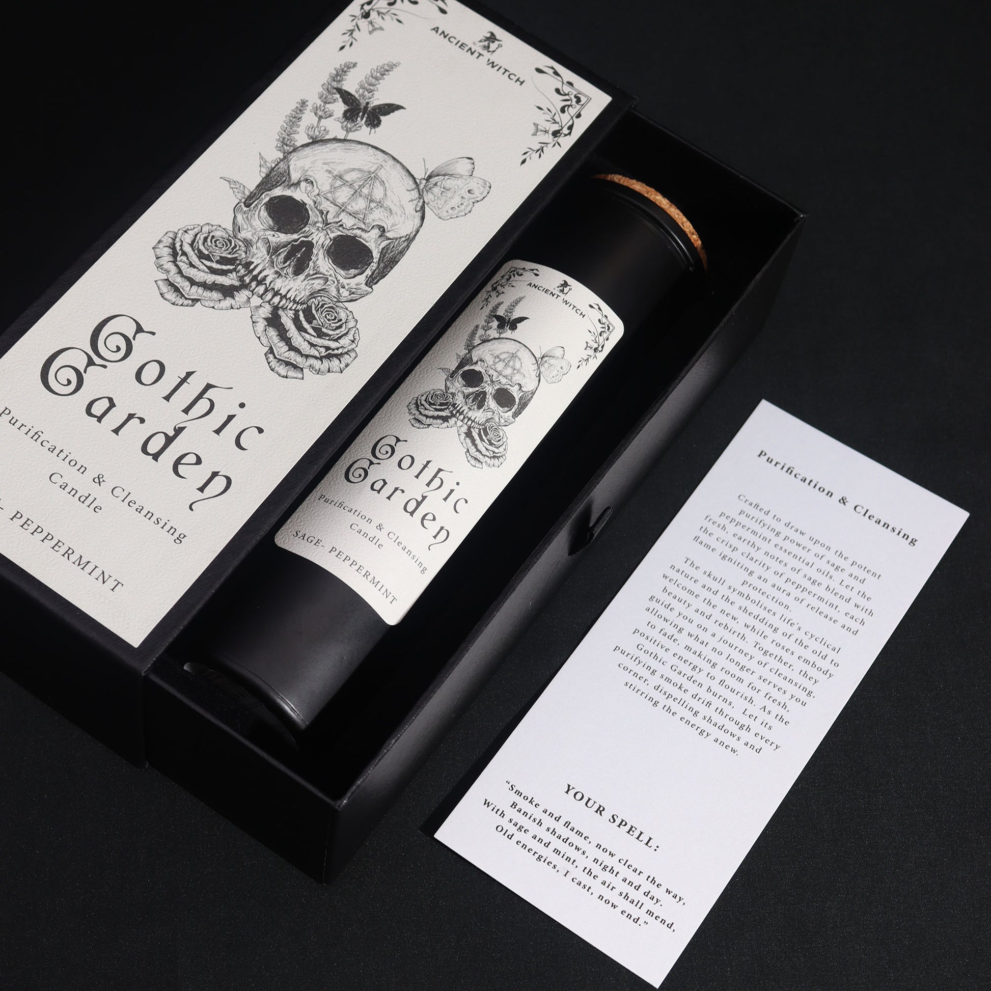 Gothic Garden Purification and Cleansing Candle with Sage and Peppermint by Spirit & Shadow – boxed black soy wax spell candle with skull and rose design and included ritual spell card