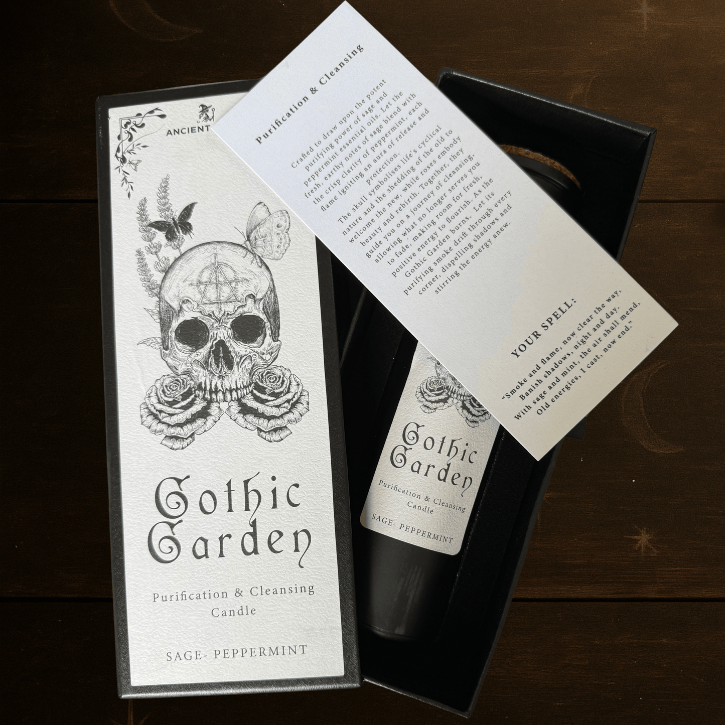 Gothic Garden Purification and Cleansing Candle with Sage and Peppermint by Spirit & Shadow – boxed black soy wax spell candle with skull and rose design and included ritual spell card