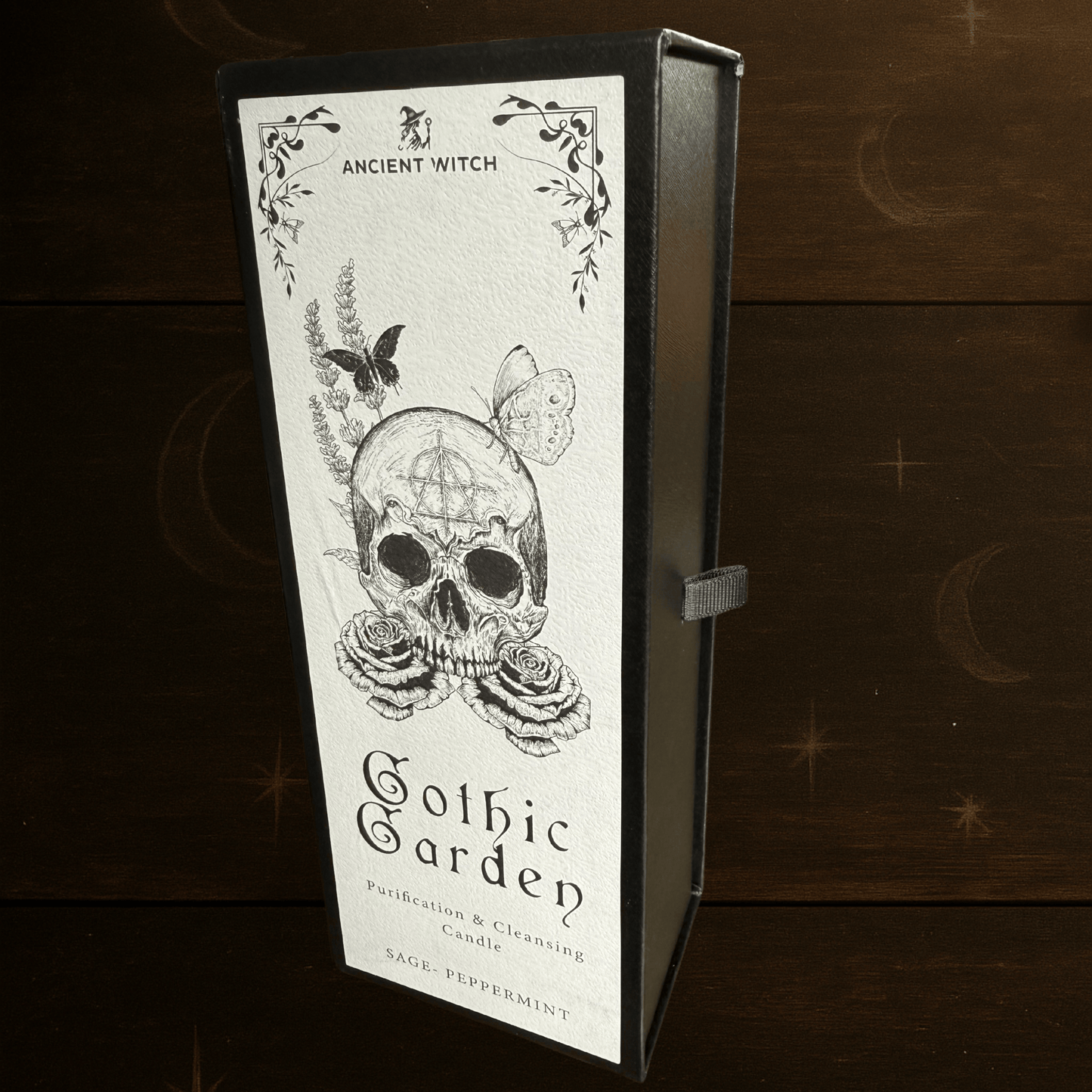 Gothic Garden Purification and Cleansing Candle with Sage and Peppermint by Spirit & Shadow – boxed black soy wax spell candle with skull and rose design and included ritual spell card