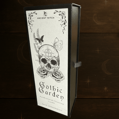 Gothic Garden Purification and Cleansing Candle with Sage and Peppermint by Spirit & Shadow – boxed black soy wax spell candle with skull and rose design and included ritual spell card