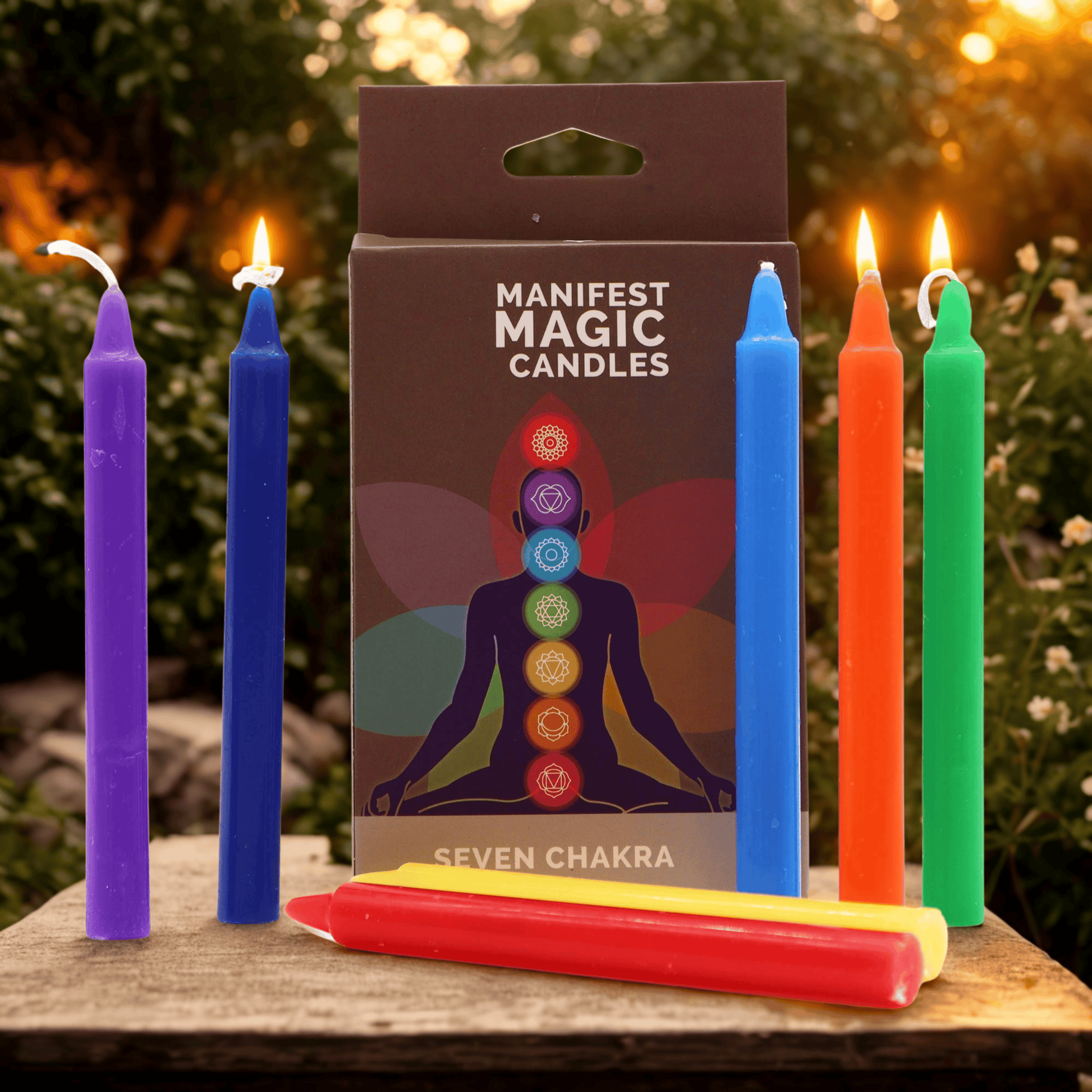 Set of 7 Chakra colour candles with a 'Manifest Magic Candles' packaging featuring seven Chakra symbols on a natural background.