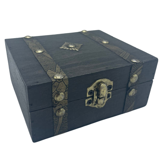 Wooden treasure chest with decorative straps and lock on a white background