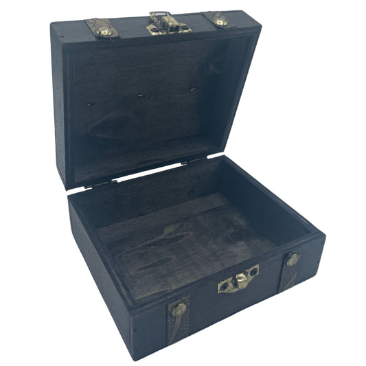 Open dark blue wooden trunk with brass locks on a white background