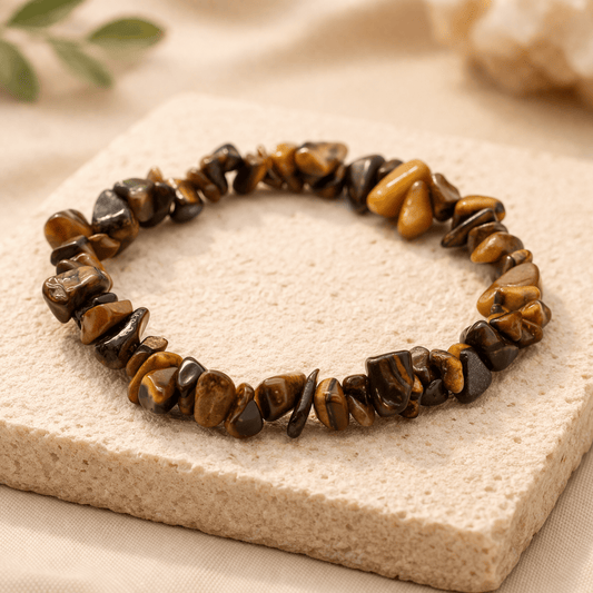 Tiger's eye stone bracelet on a textured surface with a neutral background