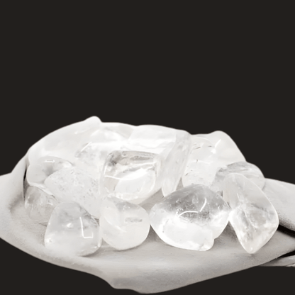 Clear Quartz on a grey cloth with a black background