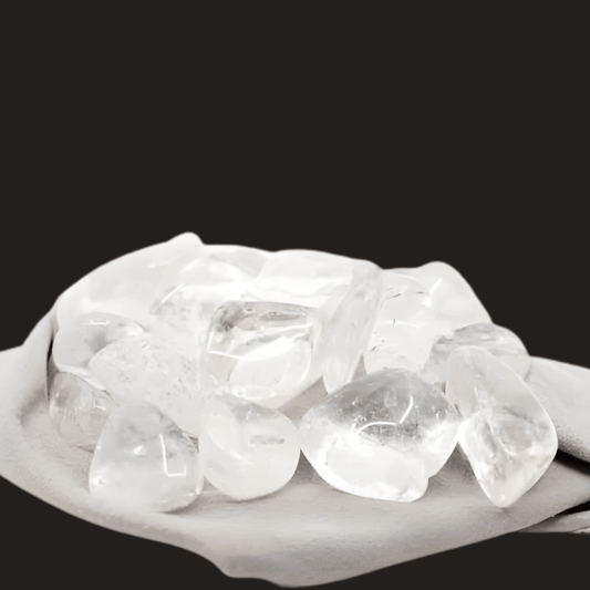 Clear Quartz on a grey cloth with a black background