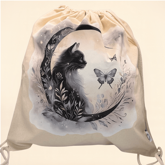 Drawstring bag with a black cat and butterfly Cresent moon design on a beige background 