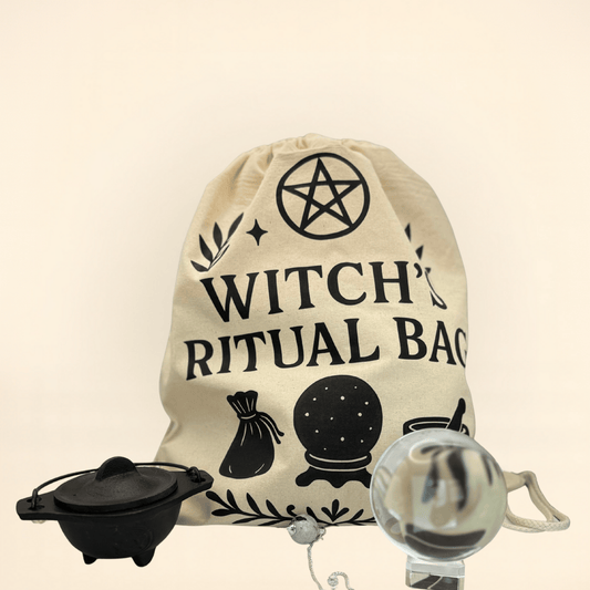Beige drawstring bag with 'Witch Ritual Bag' text and symbols, accompanied by a black Cauldron and a crystal ball and pendulum on a beige background.