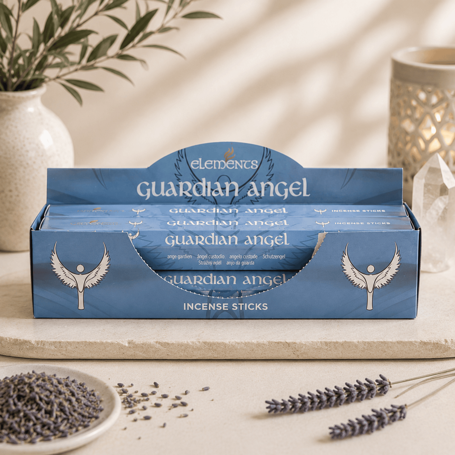 Box of 'Guardian Angel' incense sticks with lavender and a plant in the background