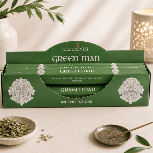 Green Man incense sticks packaging with incense sticks and accessories on a neutral background