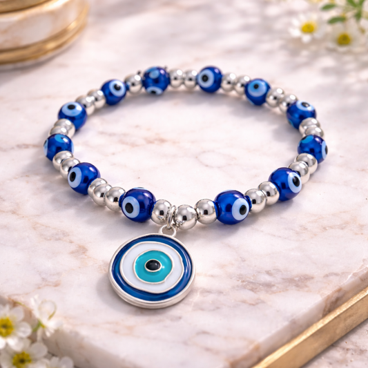 Bracelet with blue and silver beads con a marble surface