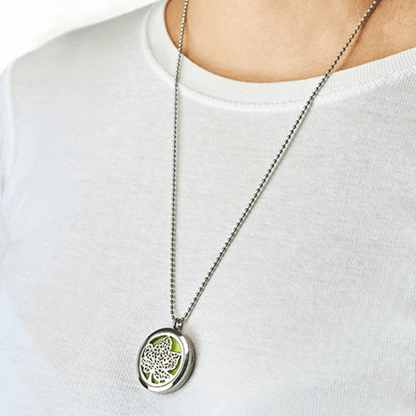 Necklace with a leaf pendant on a white shirt