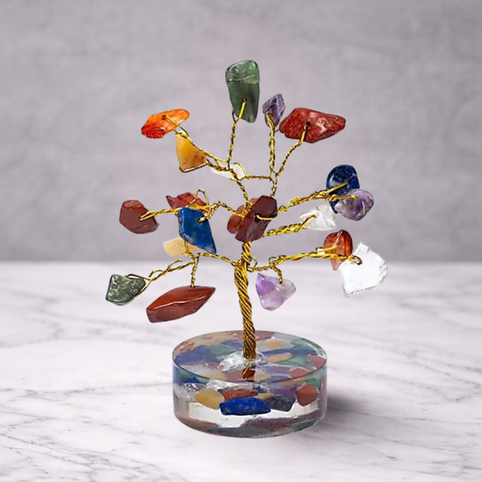 7 chakra crystal gemstone tree with multicolour stones on a decorative base, used for feng shui, energy balance and spiritual home decor