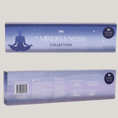 Two rectangular boxes of incense sticks shown against a plain light gray background. The top box is the front packaging with a blue gradient design, a meditating silhouette, and the text 'THE MINDFULNESS COLLECTION' plus '80 INCENSE STICKS.
