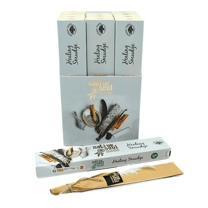 A set of Naliue Soul Healing Smudge boxes and individual packets on a white background. The packaging is a pale blue-gray color with illustrations of herbs, bark, and the individual packets are made of natural brown paper with a black and gold label.
