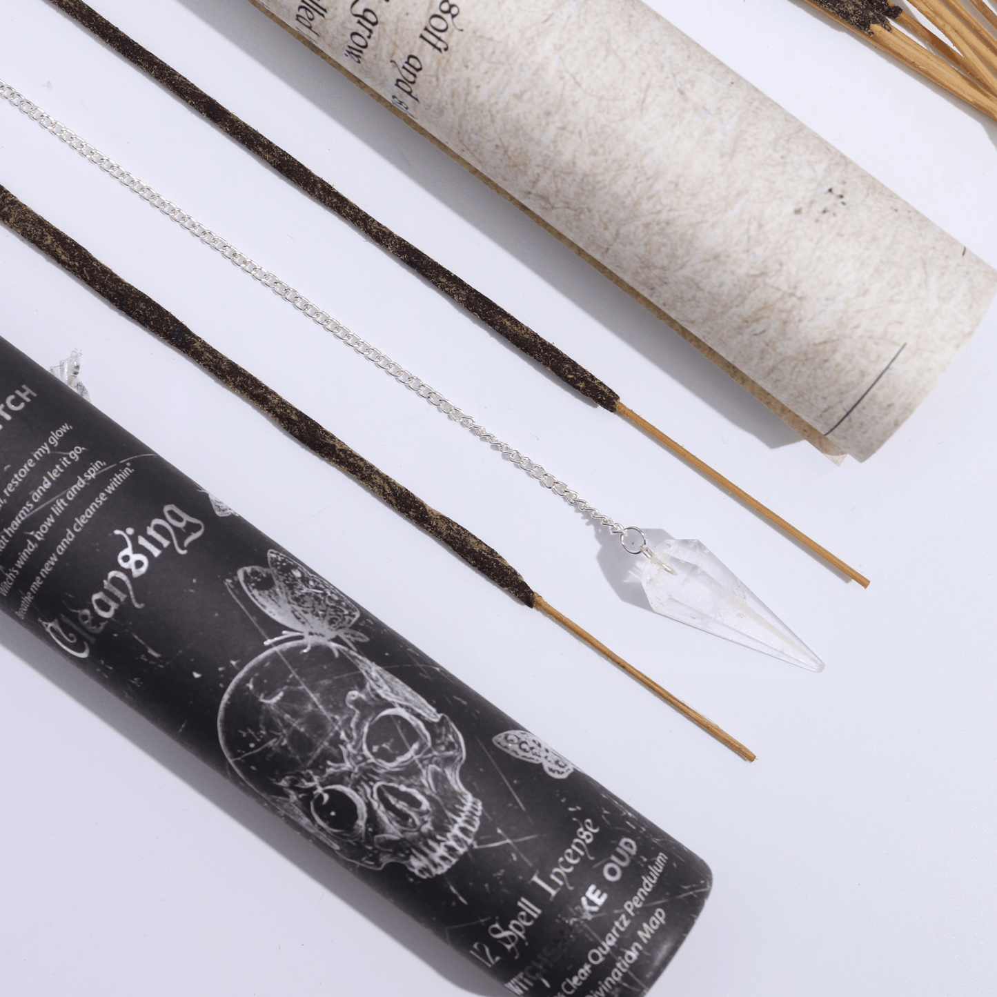 Incense sticks with packaging and tools on a white background