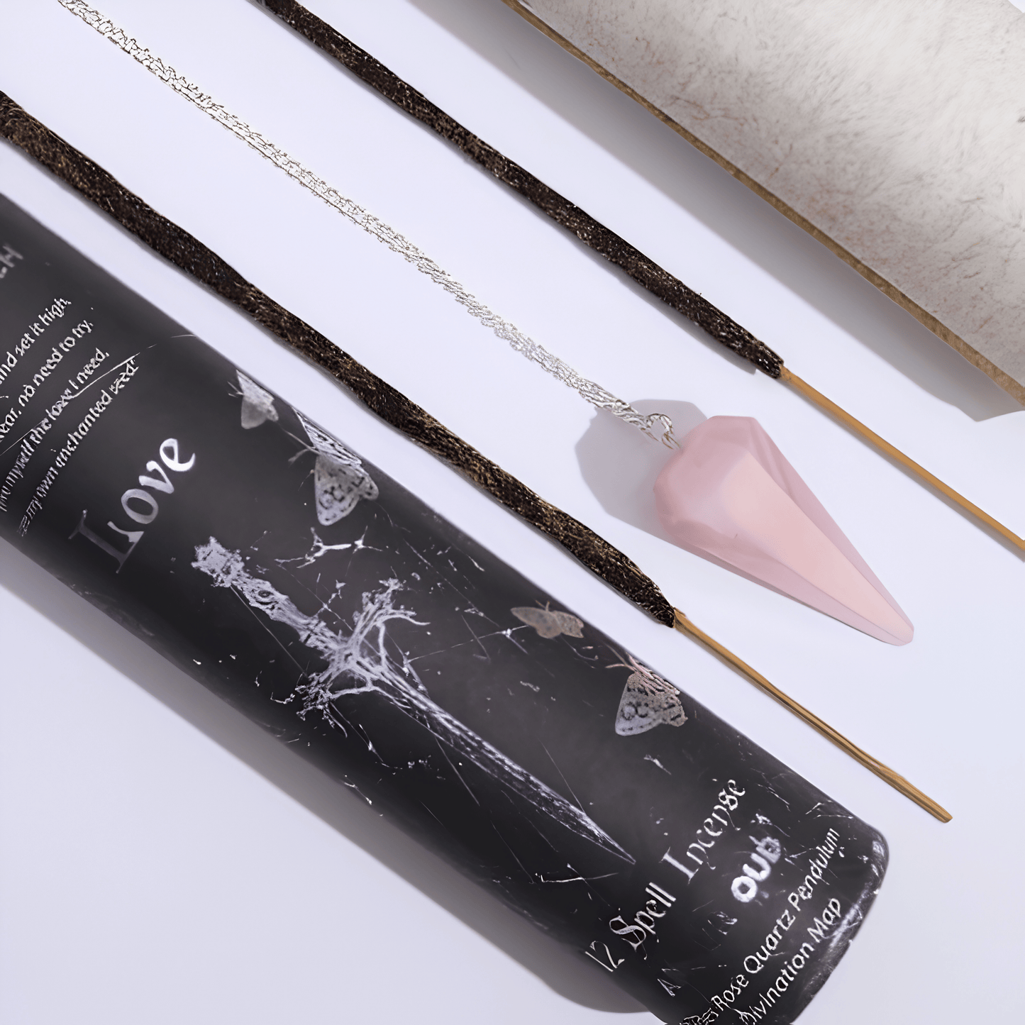 Incense sticks with a black packaging labeled 'Love' on a light background