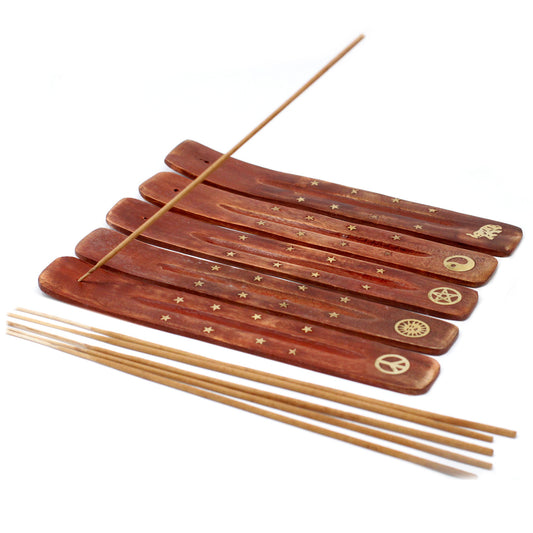 Set of wooden incense sticks with decorative ends on a white background