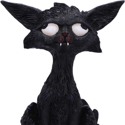Black cat figurine with large white eyes and pointed ears on a white background